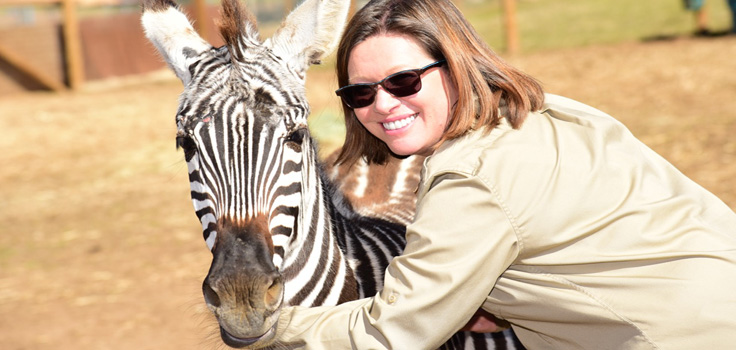 Agnes Barrelet and Hope the zebra sharing a hug at Children's Nature Retreat copy