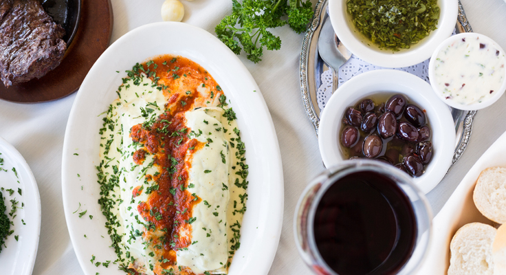 Canelones (Cannellonis filled with Spinach, Mozzarella and Ricta Cheese with Cream Sauce topped with tomato sauce)